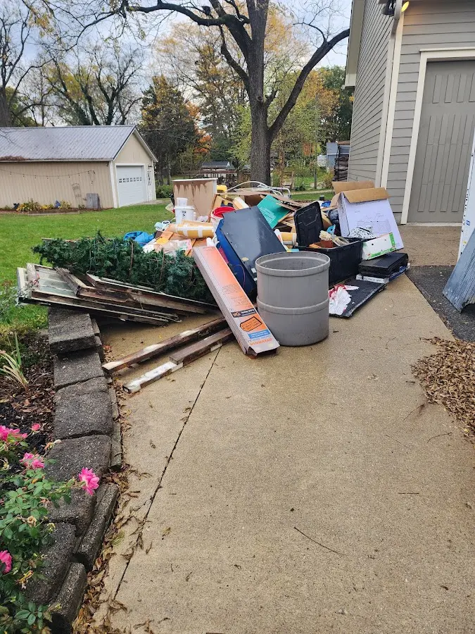 Dumpster being loaded with debris for Demolition Dumpster Rental in Greenwood Village